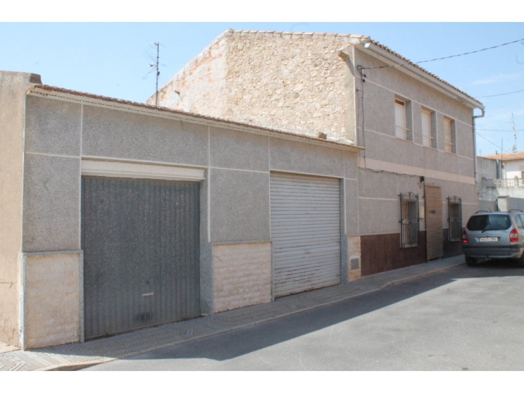 VILLAGE PROPERTY  WITH TWO HUGE GARAGES 